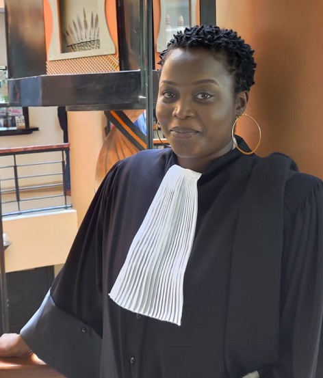 Cathy smiling in a suit