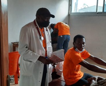 A doctor talking to a patient.